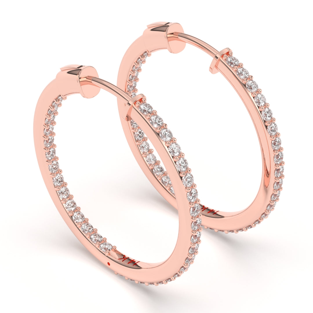 Elegant rose gold hoop earrings encrusted with sparkling diamonds on a white background.
