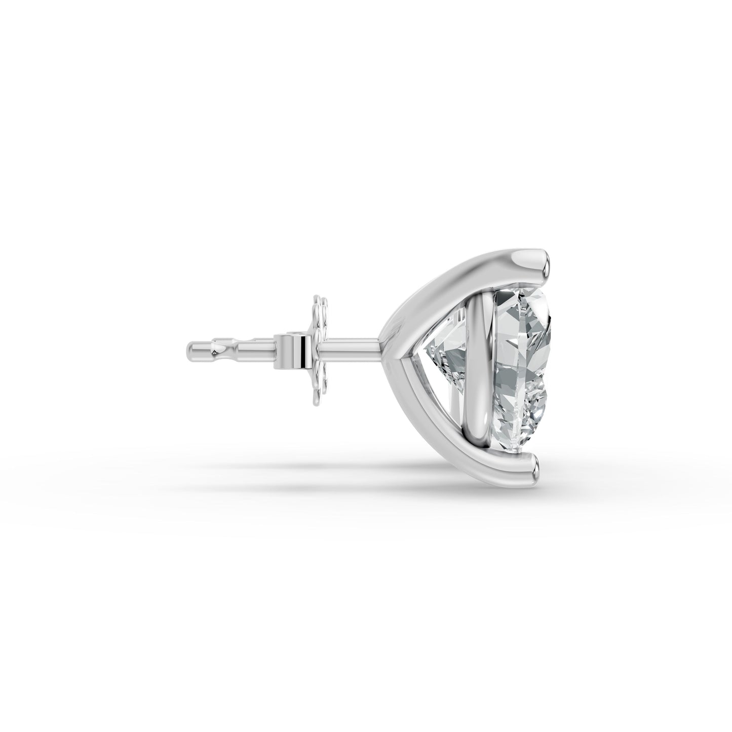 Side view of a silver stud earring featuring a heart shaped, clear diamond in a secure, minimalist prong setting. Modern and refined.