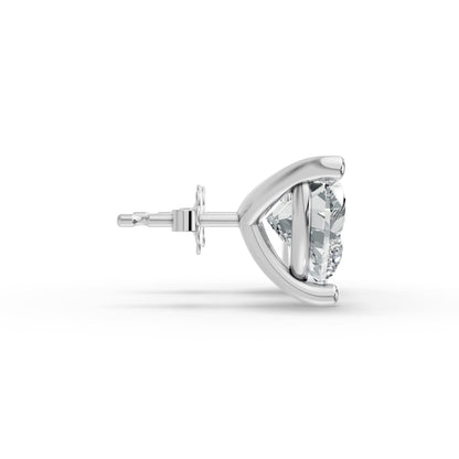 Side view of a silver stud earring featuring a heart shaped, clear diamond in a secure, minimalist prong setting. Modern and refined.
