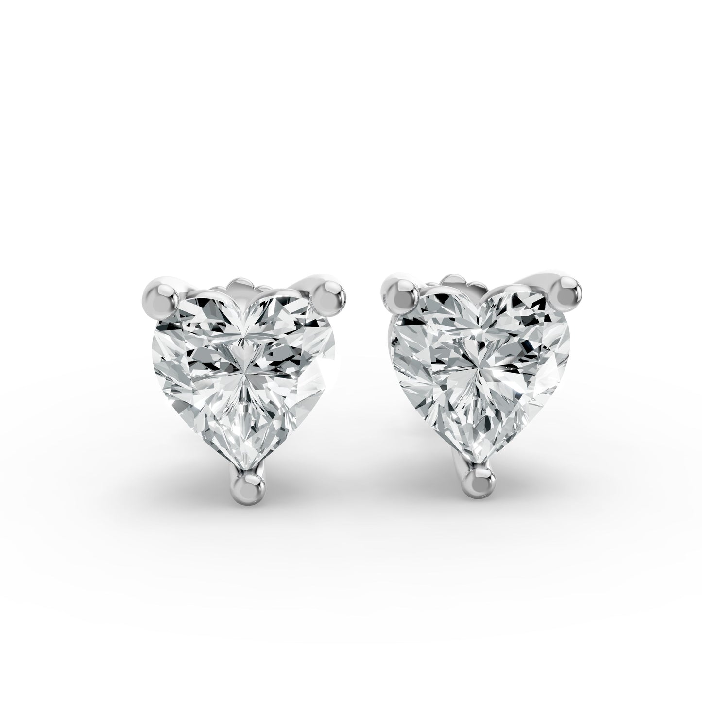 Silver heart-shaped stud earrings with brilliant cut diamonds. They sparkle beautifully, exuding elegance against a white background.