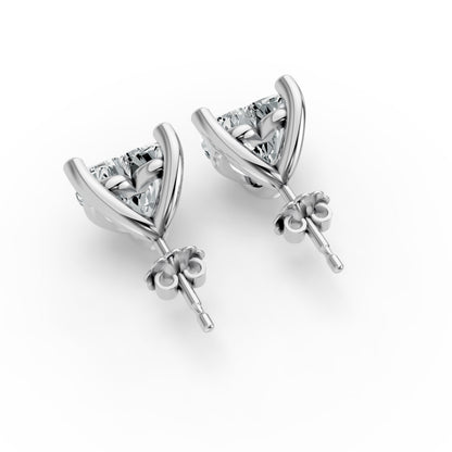 Silver stud earrings with sparkling heart shape diamond set in a delicate prong setting. Elegant with a polished finish.