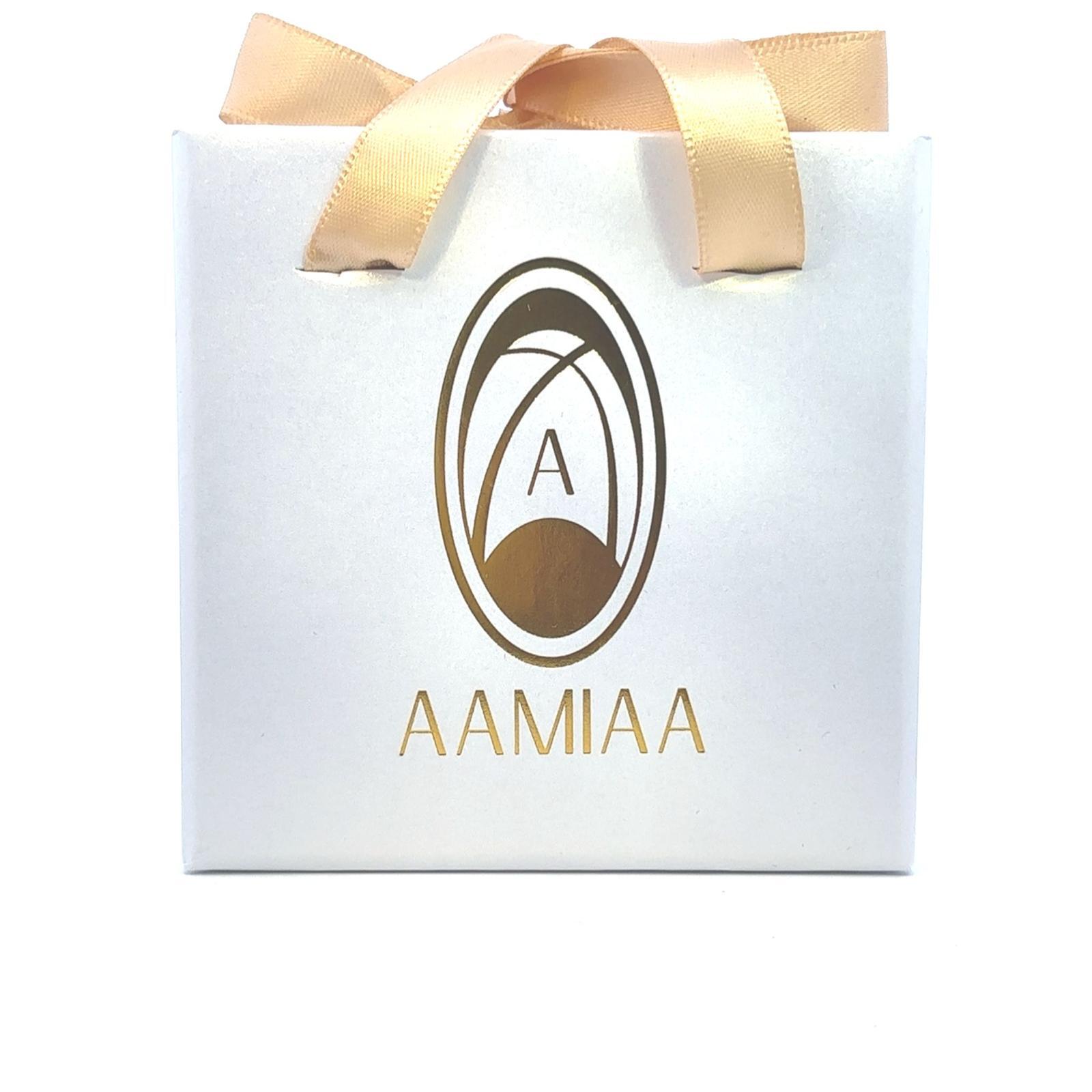 White gift bag with gold handles featuring "AAMIAA" logo in gold and black. Elegant, luxurious, and simple design.