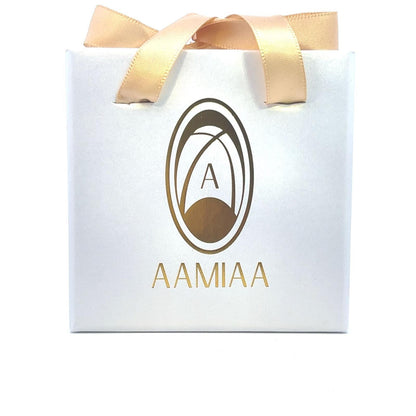 Sleek white shopping bag with gold AAMIAA logo and shiny golden handles, conveying elegance and luxury.