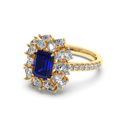 14k gold ring with 2.50CT blue sapphire and halo diamonds, featuring diamond-adorned band for elegant sparkle