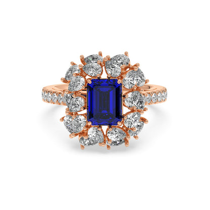 14k rose gold ring with 2.50CT blue sapphire and a halo of round diamonds, offering an elegant, luxurious look