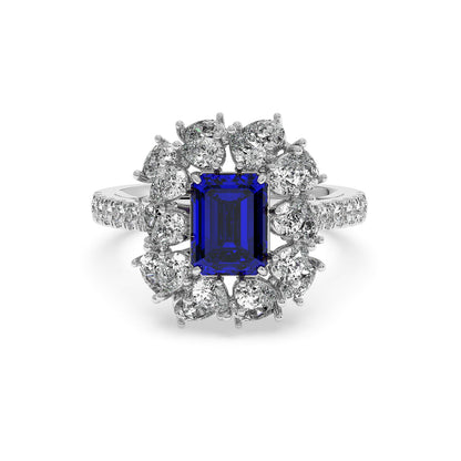 Elegant 14k white gold ring with a 2.50CT blue sapphire and round diamonds on the halo and band, offering a luxurious, sophisticated design