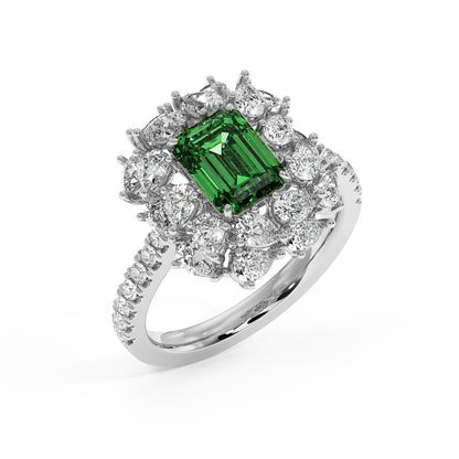 Top view of a 14k white gold ring with 2.50CT green YAG emerald-cut center and diamond halo on a sparkling band