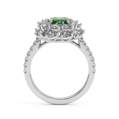 Elegant 14k white gold ring with 2.50CT green YAG and a halo of diamonds on a diamond-studded band.