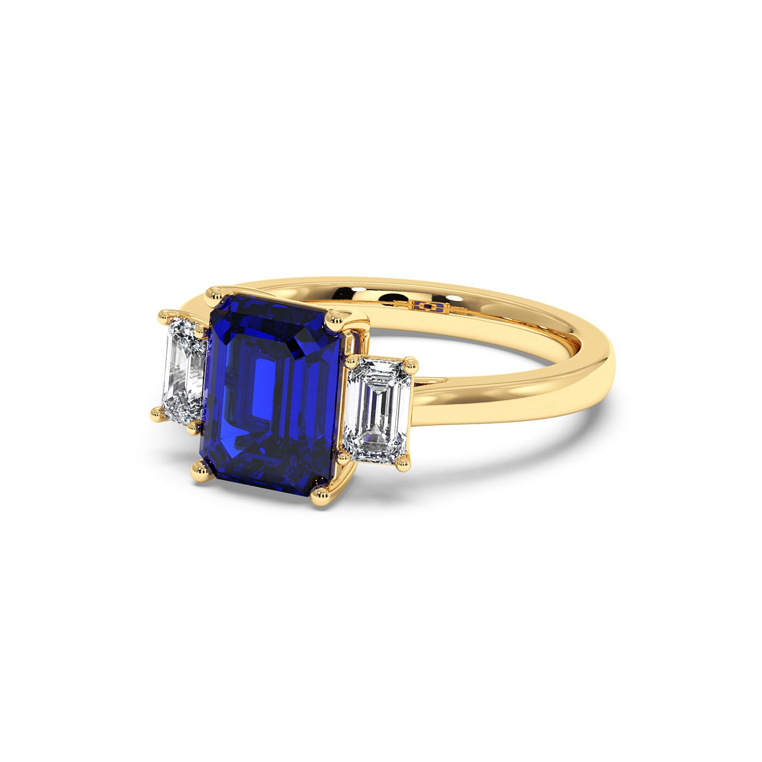 Elegant gold 3.5 carat blue sapphire ring with deep blue rectangular center gemstone and two smaller clear diamonds.