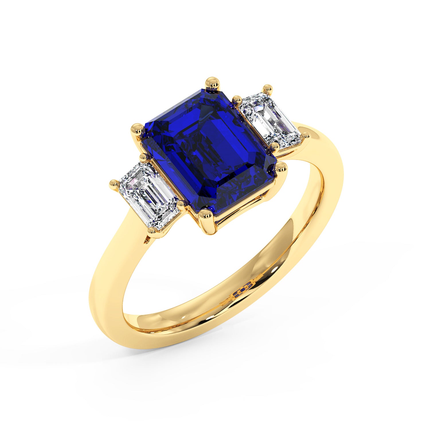 Top view of elegant gold 3.5 carat blue sapphire ring with large rectangular gemstone and two smaller diamonds.