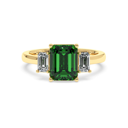 Gold 3.5 carat green YAG ring with large rectangular center gemstone and two smaller rectangular clear stones. Elegant design.
