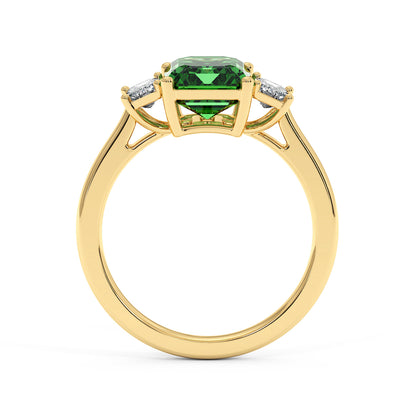 Gold 3.5 carat green YAG ring with vibrant center gemstone and two smaller white stones. Elegant and sophisticated design.