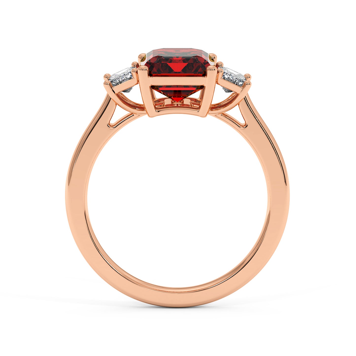 Elegant rose gold 3.5 carat emerald cut ring with red gemstone and two smaller white stones.