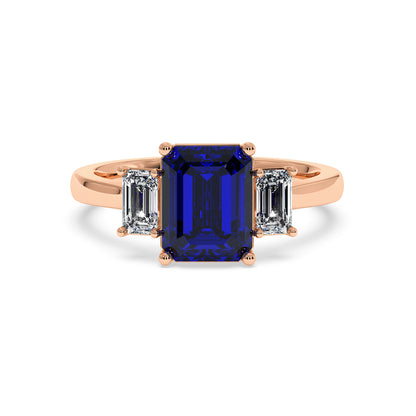 Elegant rose gold 3.5 carat blue sapphire ring with emerald-cut center stone and two diamond sides