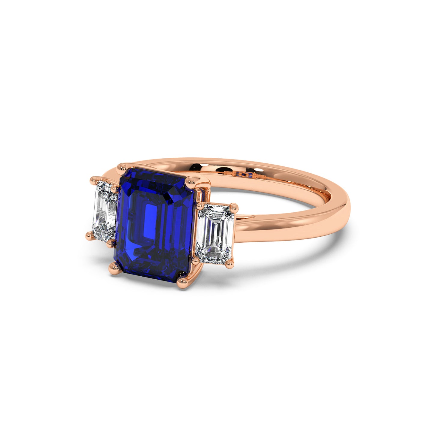 Rose gold 3.5 carat sapphire ring with blue gemstone and two rectangular white diamonds. Elegant look.