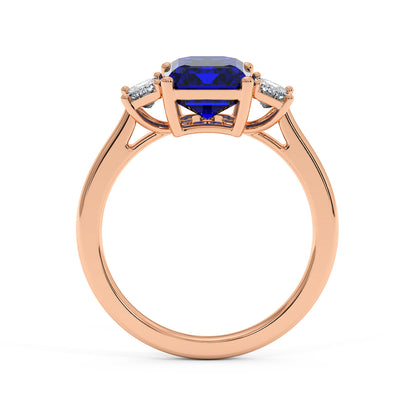 Rose gold 3.5 carat blue sapphire ring with deep blue gemstone and small sparkling diamonds. Elegant design.
