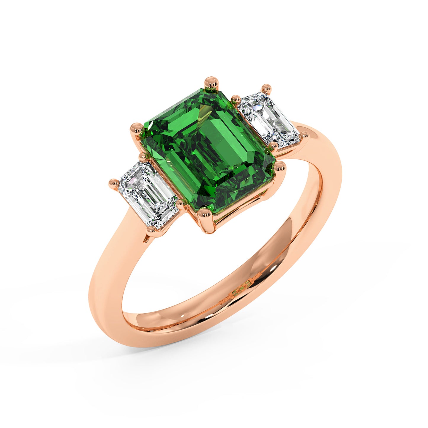 Top view of rose gold 3.5 carat emerald cut ring with green gemstone and two smaller emerald-cut diamonds