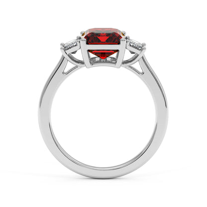 14k white gold 3.5 carat emerald cut ring with red gemstone and two smaller clear stones. Elegant style.