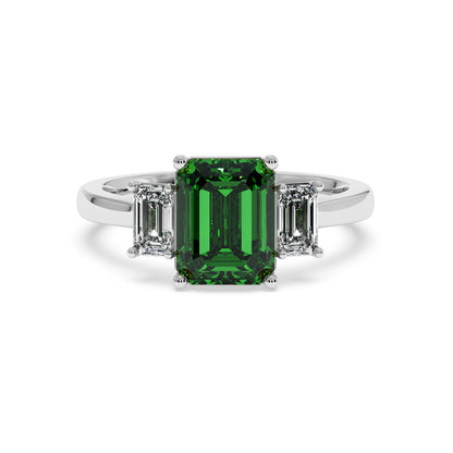 14k white gold 3.5 carat green YAG ring with emerald-cut center gemstone and two smaller white diamonds. Elegant design.