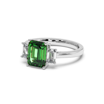 14k white gold 3.5 carat green YAG ring with emerald-cut center gemstone and two smaller rectangular diamonds.