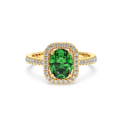 14k gold ring features a vibrant green YAG at its center, surrounded by a halo of small sparkling diamonds