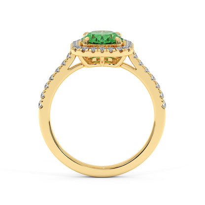 14k gold ring with a vibrant green YAG centerpiece, surrounded by small diamonds in a halo setting. Diamonds also adorn the slender band
