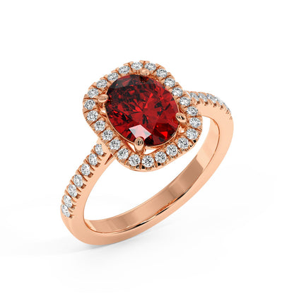 Top view of a 14k rose gold ring with a deep 2.50CT oval red ruby and halo diamonds on a diamond-studded band, creating an elegant, luxurious look.