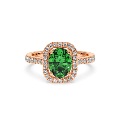 Elegant rose gold ring with a vibrant 2.50CT green YAG oval center and a halo of sparkling diamonds, creating a luxurious, refined look.