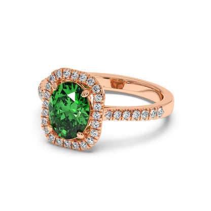 Rose gold ring with a vibrant 2.50CT green YAG oval center, haloed by white diamonds and set on a diamond-studded band for elegant luxury.