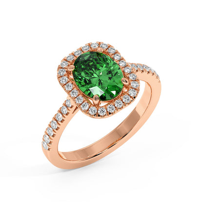 Top view of an elegant rose gold ring with a vibrant 2.50CT green YAG oval center and a halo of sparkling diamonds