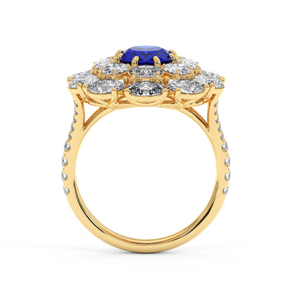 14k gold ring with a 2.50CT oval blue sapphire surrounded by small diamonds on a diamond-studded band, exuding elegance and luxury.