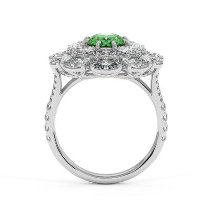 Elegant 14k white gold ring with a 2.50CT oval green YAG surrounded by clear diamonds on a diamond-studded band, exuding luxury.