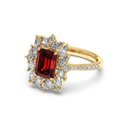 14k gold ring with a 2.25CT emerald-cut red ruby center, surrounded by marquise diamonds on a diamond-studded band, exuding elegance.