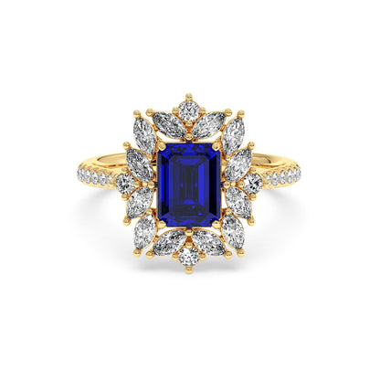 14k gold ring with a 2.25CT blue sapphire emerald-cut center, surrounded by marquise diamonds, exuding luxury and sophistication.