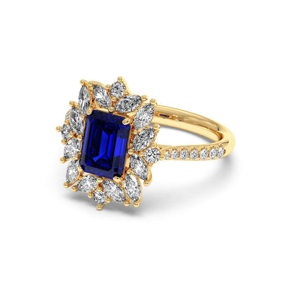 14k gold ring with a 2.25CT blue sapphire center surrounded by a halo of sparkling oval diamonds, exuding elegance and luxury.