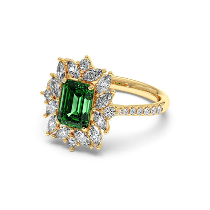 14k gold ring with a 2.25CT emerald-cut green YAG, surrounded by marquise diamonds in a floral design, with a diamond-studded band.