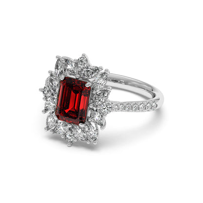 14k white gold ring with a rectangular 2.25CT red ruby surrounded by white diamonds on a diamond-studded band, exuding luxury.