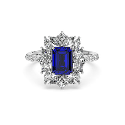 Elegant ring with a rectangular 2.25CT blue sapphire center, surrounded by marquise diamonds and a diamond-studded band.