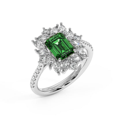Top view of 14k white gold ring with a 2.25CT emerald-cut green YAG, framed by marquise and round diamonds on a diamond-studded band.