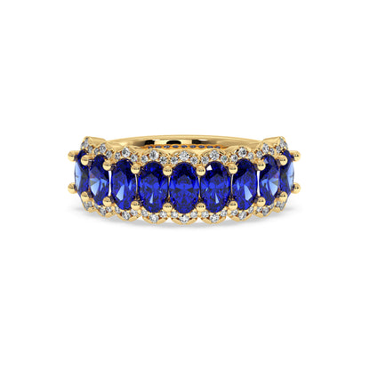 14k gold ring set with six oval Blue Sapphire gemstones, surrounded by small sparkling white diamonds.