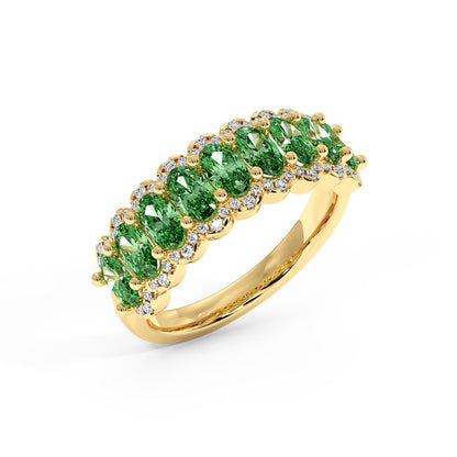 14k gold ring with a row of vibrant Green YAG gemstones, each surrounded by small sparkling diamonds.