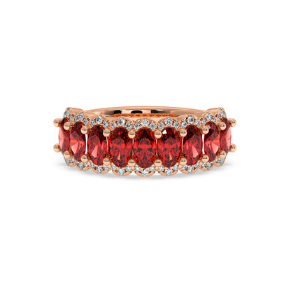 14k gold ring with radiant oval-cut Red Ruby gemstones and small round diamonds set along the band.