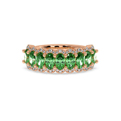 14k rose gold ring featuring a row of vibrant Green YAG oval gemstones, accented by small round diamonds.