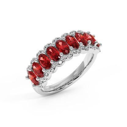 Elegant 14k white gold ring with a row of oval Red Ruby gemstones, each surrounded by small diamonds.