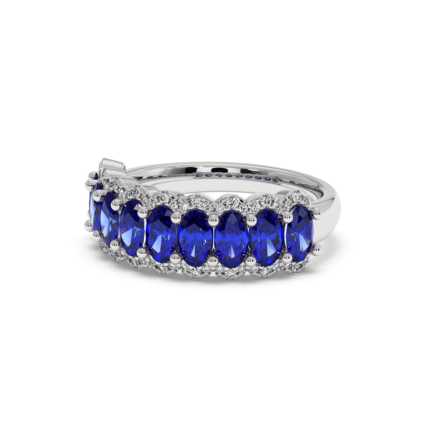 14k white gold ring adorned with oval-cut Blue Sapphire gemstones, bordered by small, sparkling diamonds.