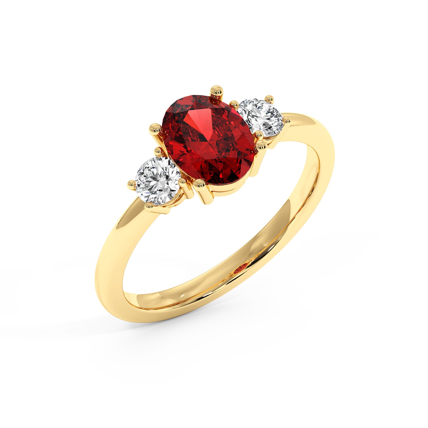 Top view of gold ring with a central red oval ruby flanked by two round diamonds, showcasing an elegant and luxurious design.