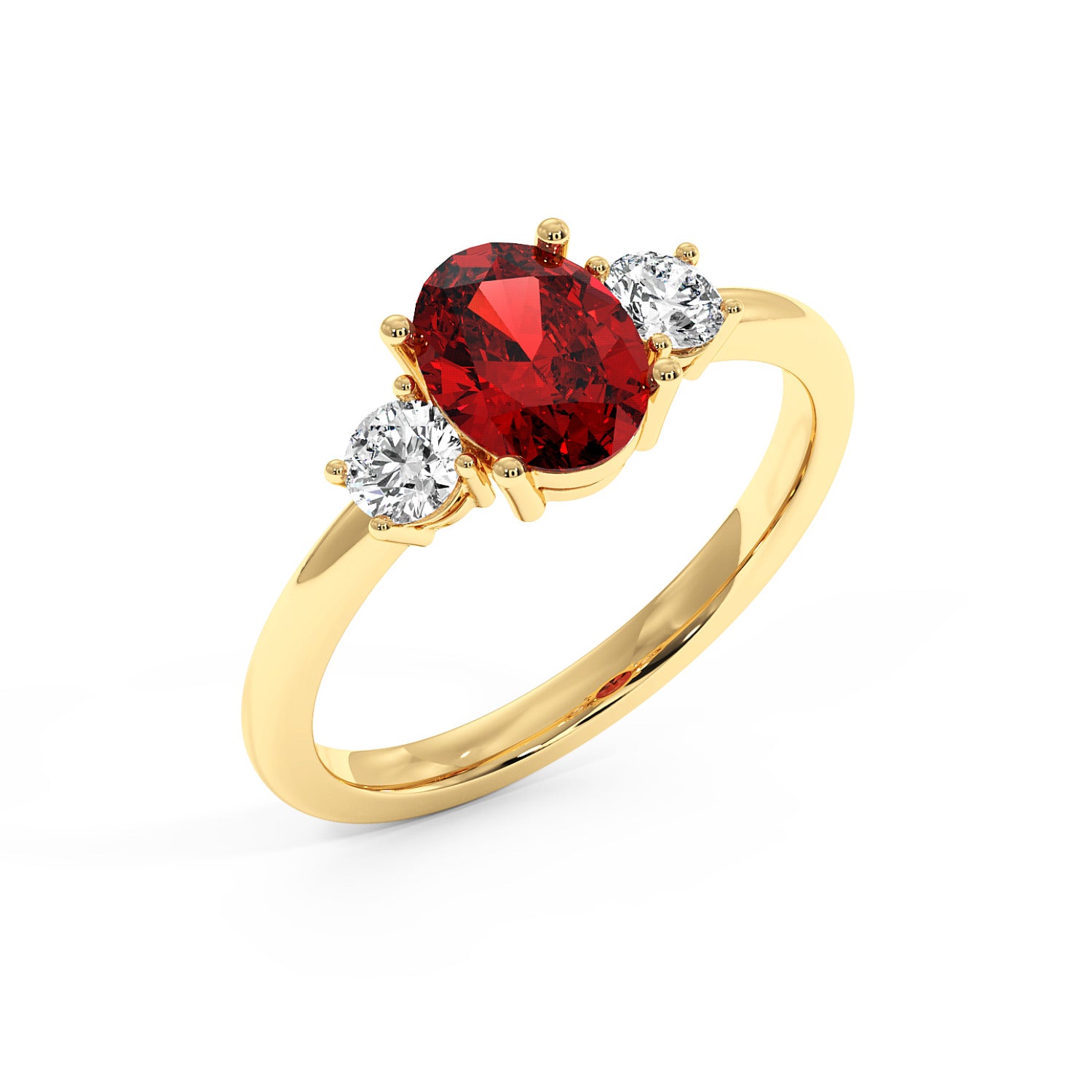 Top view of gold ring with a central red oval ruby flanked by two round diamonds, showcasing an elegant and luxurious design.