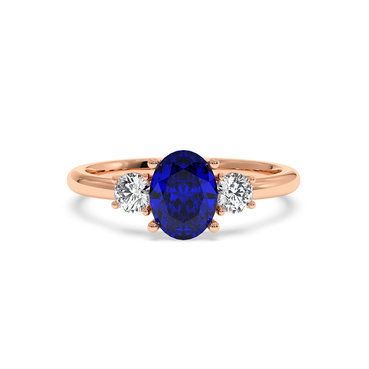 Rose gold 1.75CT oval sapphire ring with large blue center gemstone flanked by two round brilliant diamonds. Elegant design.