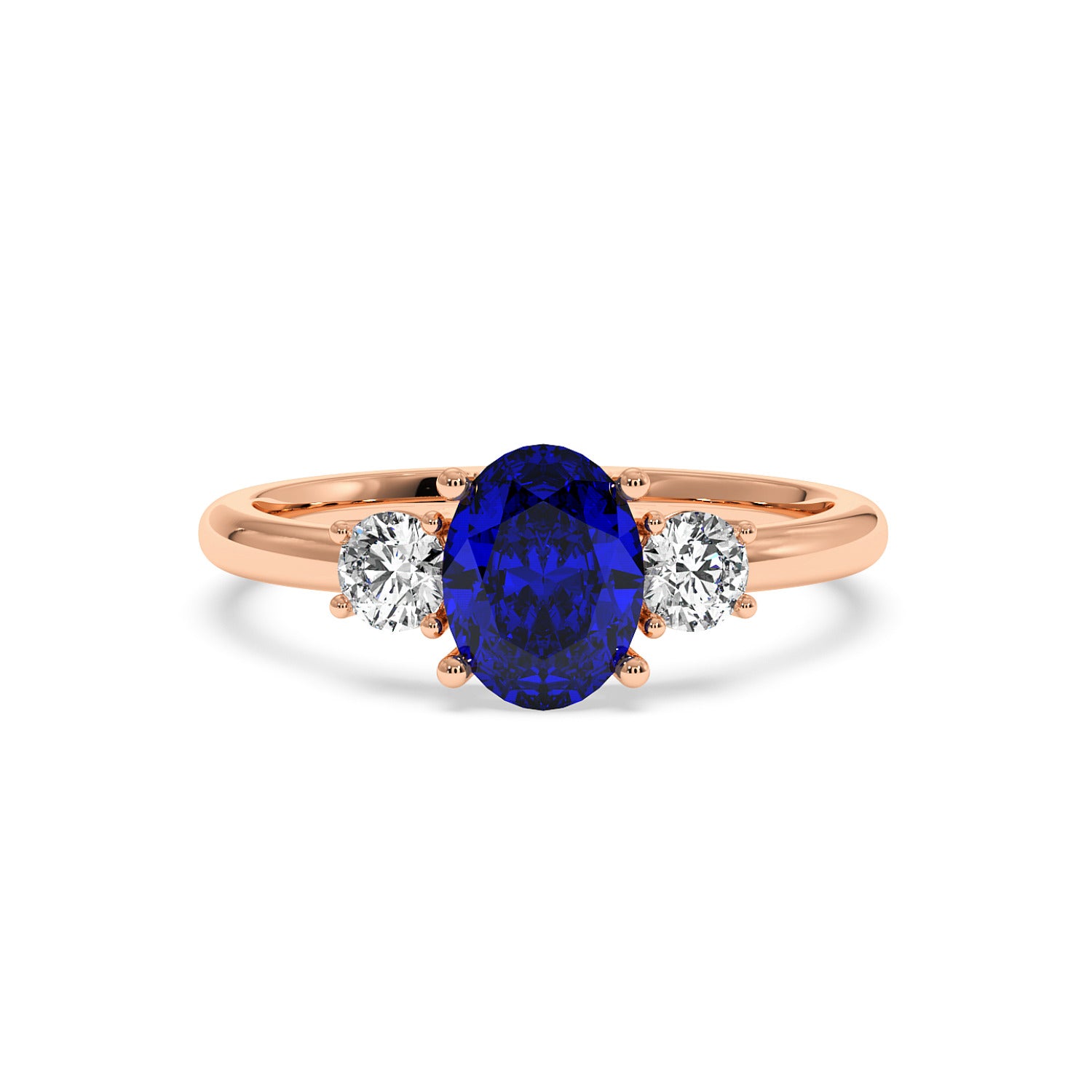 Rose gold 1.75CT oval sapphire ring with large blue center gemstone flanked by two round brilliant diamonds. Elegant design.