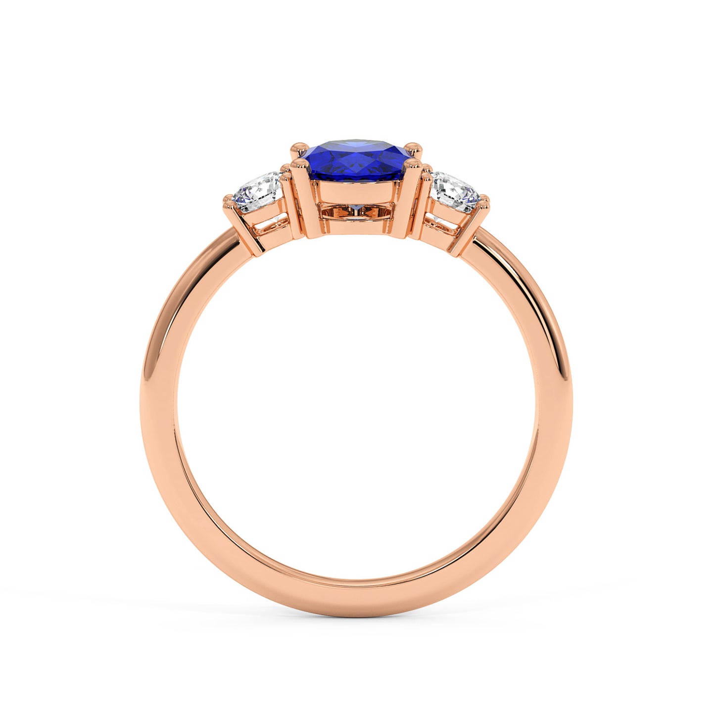 Rose gold 1.75CT oval sapphire ring with blue center stone flanked by two smaller diamonds. Elegant, luxurious design.